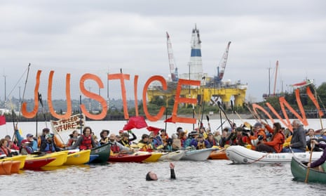 Activists protest the Shell Oil Company’s drilling rig Polar Pioneer which is parked at Terminal 5 at the Port of Seattle.