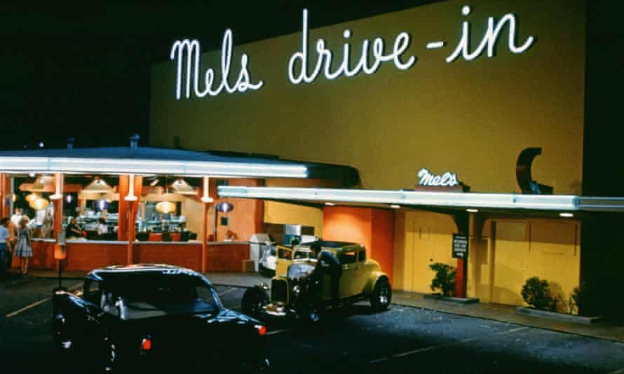 Hot rods and neon signs in American Graffiti (1973)