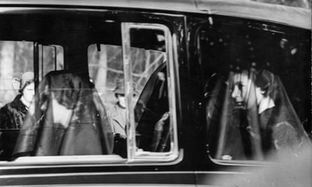 Queen Elizabeth II (right) and Princess Margaret Rose (1930 - 2002), wearing black veils in the mourning cortege of their late father, King George VI between Sandringham House, Norfolk and Westminster Hall, London