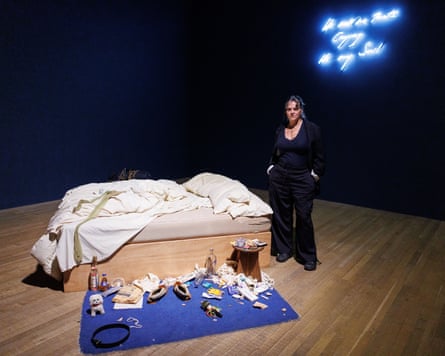 Tracey Emin poses with her artwork My Bed.