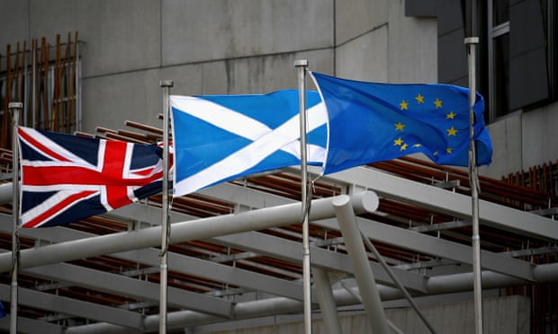 The flags of the UK, Scotland and the EU outside the Scottish parliament.