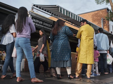 Customers wait in long queues outside the famous Jaipur Sweet shop in Harris Park, 2022