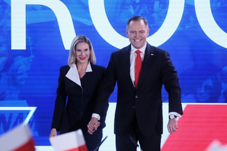 Karol Nawrocki (R) with his wife Marta Nawrocka (L) during the presidential election night in Warsaw.