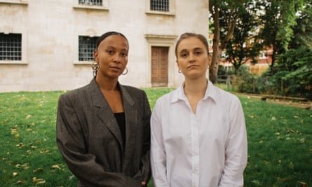 Ella Janneh and Catriona Rubens pose for a picture in a garden