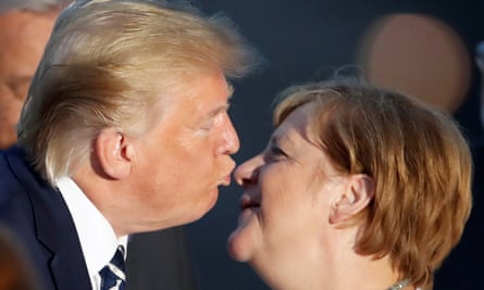 Donald Trump greets Angela Merkel at the G7 summit in France in August.