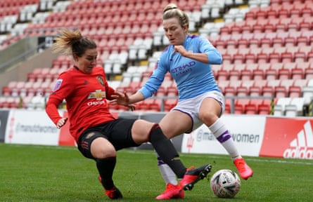 Amy Turner slides in to tackle Manchester City’s Lauren Hemp.