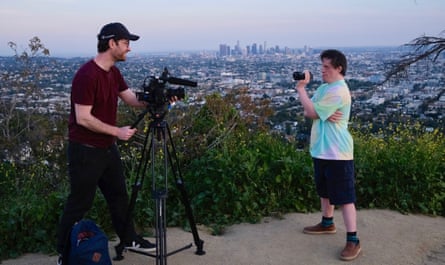 Will and Tommy Jessop film each other with LA landscape behind