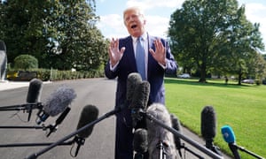 Donald Trump speaks to journalists outside the White House