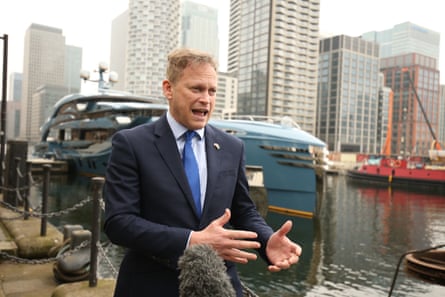 Transport Secretary Grant Shapps by the superyacht Phi owned by a Russian businessman in Canary Wharf, east London which has been detained as part of sanctions against Russia.