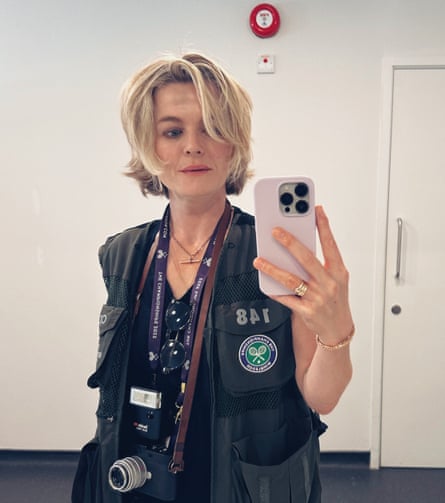Sarah Lee takes a selfie while wearing a Wimbledon-issued sleeveless mesh jacket
