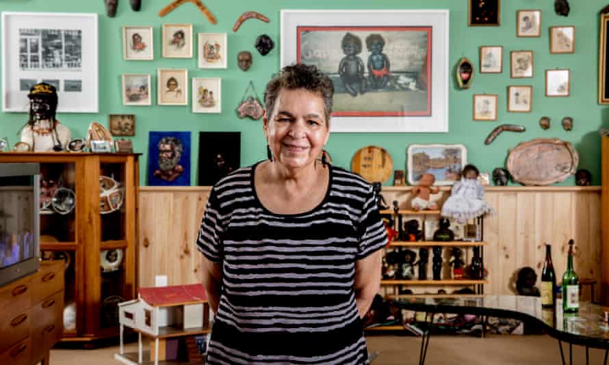 Artist Destiny Deacon, standing in DESTINY, the retrospective of her work that showed at NGV Australia in 2020 and 2021.