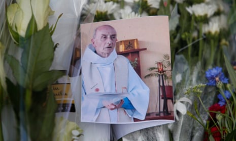 A photo of slain priest Jacques Hamel at a memorial at the Saint-Etienne-du-Rouvray city hall, near Rouen, France