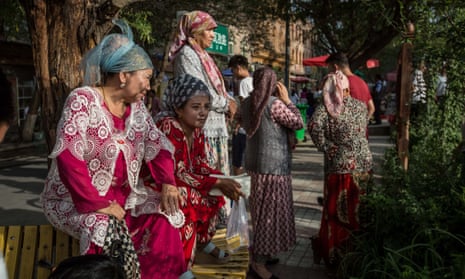 Uighur women wearing traditional clothes in Kashgar, in the north-western province of Xinjang where nearly 10 million Muslim Uighurs live.