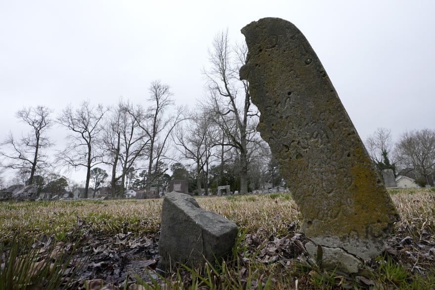 A deteriorating tombstone is close to collapse at the Lincoln memorial cemetery in Portsmouth, Virginia, in March. Many Black Americans excluded from white-owned cemeteries built their own burial spaces, and their descendants are working to preserve the grounds.