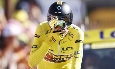 The yellow jersey, Danish rider Jonas Vingegaard of Jumbo-Visma, reacts as he crosses the finish line of the 20th stage