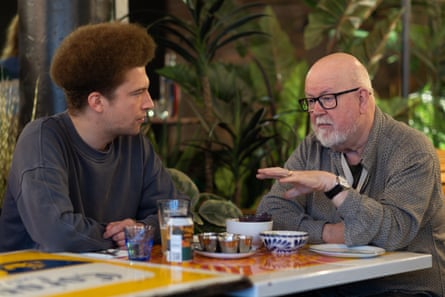 Alex and Mike chatting across a restaurant table