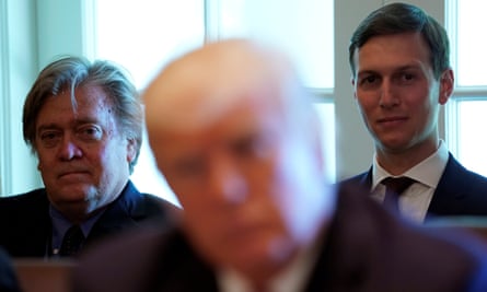 Steve Bannon, left, and Jared Kushner listen as Donald Trump meets with members of his cabinet at the White House on 12 June 2017.
