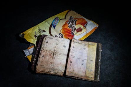 A contacts book and food packaging found on the body of a shipwrecked migrant