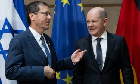 Isaac Herzog, left, with the German chancellor, Olaf Scholz, and the Munich security conference on Saturday,