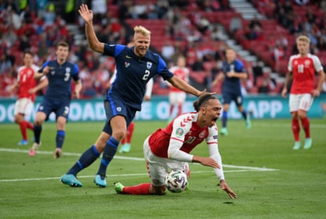 Yussuf Poulsen challenges Paulus Arajuuri leading to a penalty for Denmark.