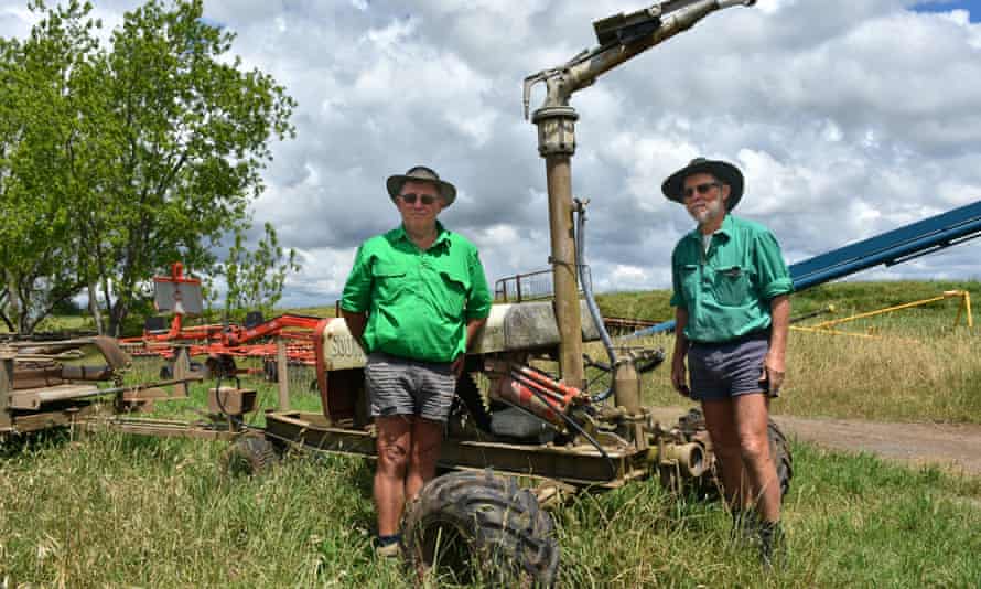 Twin brothers Stephen and Roger Osborn, pictured in front of a traveling irrigator