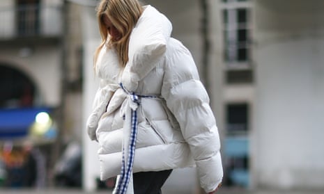 woman wears bulky white coat