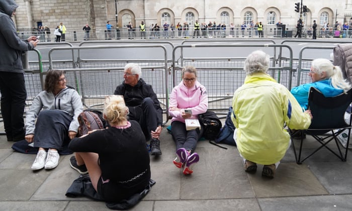 People waiting patiently for the ceremonial procession.