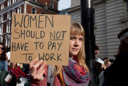 Woman with placard: ‘Women should not have to pay to work’