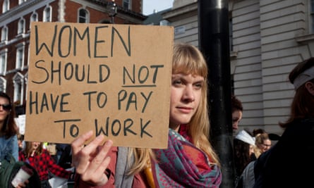 Woman with placard: 'Women should not have to pay to work'