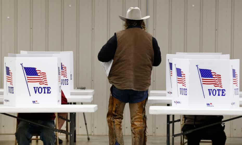 Voters at a polling station in Kansas during the 2016 election. The request has been called an attempt to ‘indulge Trump’s fantasy he won the popular vote’.