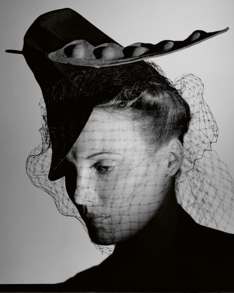 Black and white photograph of a woman wearing a hat and veil