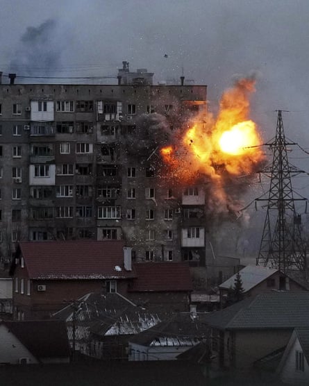 An apartment building explodes after a Russian army tank fires in Mariupol