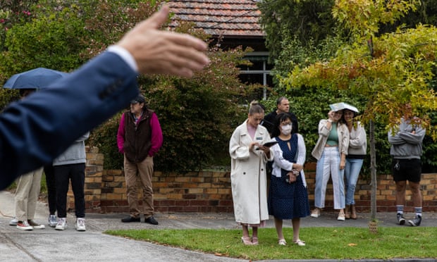 Prospective buyers at a property auction in Melbourne, the so-called 