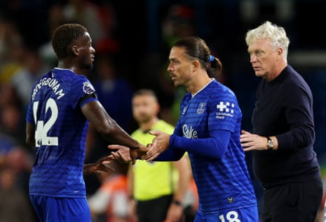 Everton's Jack Grealish comes on as a substitute to replace Tim Iroegbunam as manager David Moyes looks on.