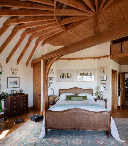 ‘The beauty in the geometry, the curved shapes of the woodwork…’ warm tones in the bedroom.