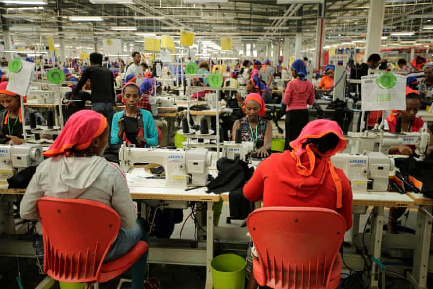 Workers sew clothes at a textile factory in Hawassa industrial park, Ethiopia