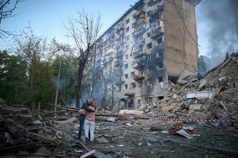 Residents react after a Russian missile hit a multi-storey apartment during Russia's combined missile and drone air attack in Kyiv, Ukraine.