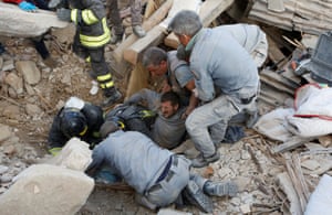 A man is rescued alive from the ruins in Amatrice