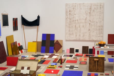 various canvases painted with black and coloured crosses