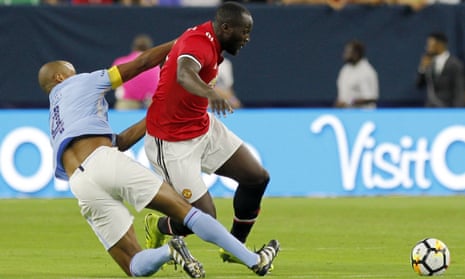 Romelu Lukaku is tackled by the Manchester City captain Vincent Kompany during the two sides’ friendly game in Houston.