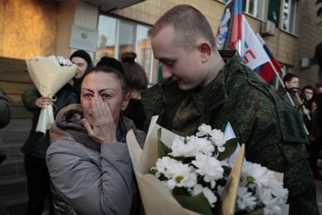 A mother of a liberated soldier reacts as she meets him after the exchange of servicemen in Amvrosiivka in Donetsk in occupied eastern Ukraine.