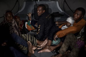 Migrants on police boat