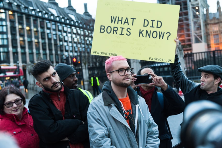 Shahmir Sanni and Chris Wylie attend a demonstration outside parliament.