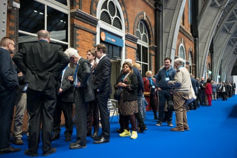 Members at the Tory conference queuing to get into the hall to hear Kemi Badenoch’s speech.