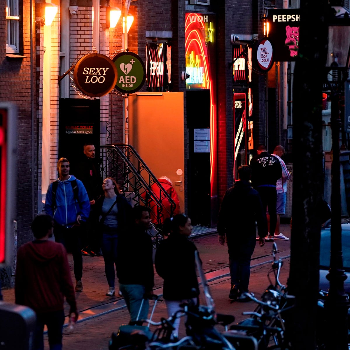No kissing': Amsterdam's red light district reopens after shutdown | The Guardian