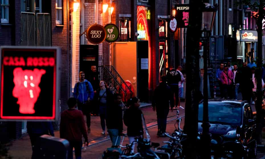 People in the red light district in Amsterdam after brothels reopened after the coronavirus shutdown.