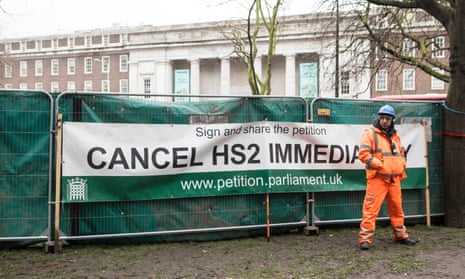 A security guard guards construction work at Euston station after anti-HS2 campaigners chained themselves to a tree to protest against the project.