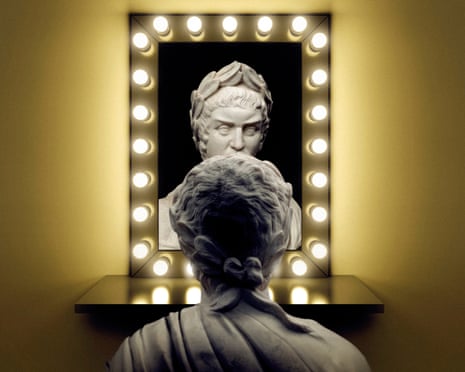 A bust of Nero looking into a mirror