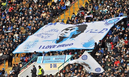 Enduring love: Napoli fans with a banner of Maradona in 2017.