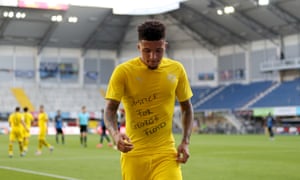 Jadon Sancho displays a message on his shirt after scoring for Dortmund against Paderborn.